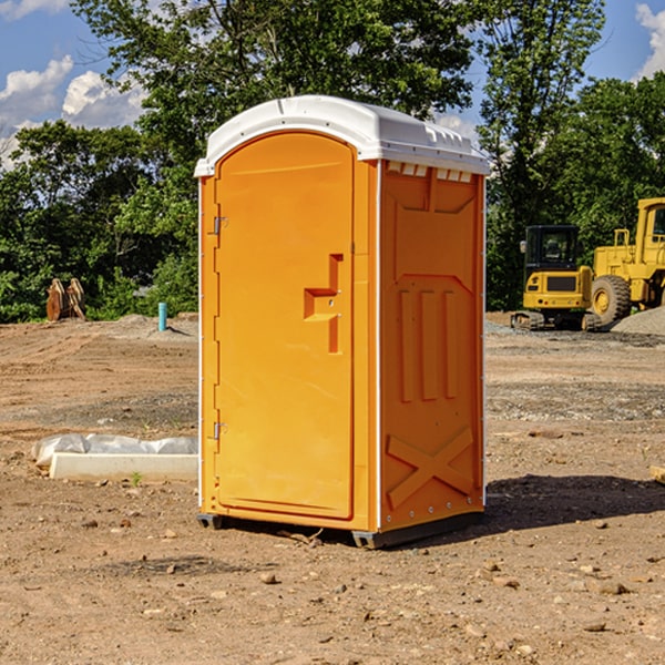 what is the cost difference between standard and deluxe portable toilet rentals in Gustine